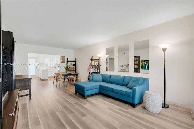 733 NW 30th Ct Unit 2, Wilton Manors, FL 33311 - living area featuring light wood-type flooring