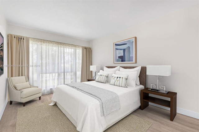 733 NW 30th Ct Unit 2, Wilton Manors, FL 33311 - bedroom with light wood finished floors and baseboards