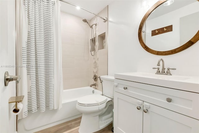 733 NW 30th Ct Unit 2, Wilton Manors, FL 33311 - bathroom with shower / bath combo, vanity, toilet, and wood finished floors