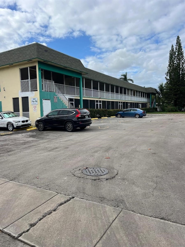 2905 Pierce St Unit 7, Hollywood, FL 33020 - view of property featuring uncovered parking