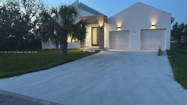 14074 Whittier Prt, Charlotte, FL 33981 - view of front facade featuring driveway, an attached garage, stucco siding, and a front yard