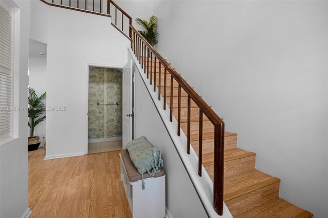 9280 Boca Gardens Pkwy Unit B, Boca Raton, FL 33496 - living area featuring light wood-type flooring, a high ceiling, and baseboards