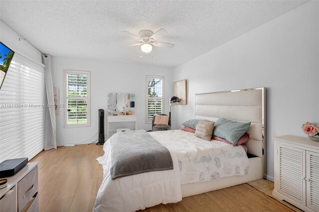 9280 Boca Gardens Pkwy Unit B, Boca Raton, FL 33496 - bedroom featuring wood finished floors, baseboards, and a ceiling fan