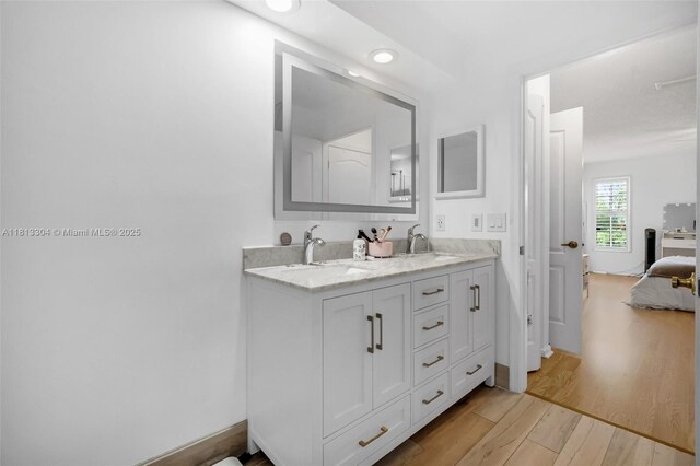 9280 Boca Gardens Pkwy Unit B, Boca Raton, FL 33496 - bathroom with a marble finish shower, double vanity, toilet, baseboards, and recessed lighting