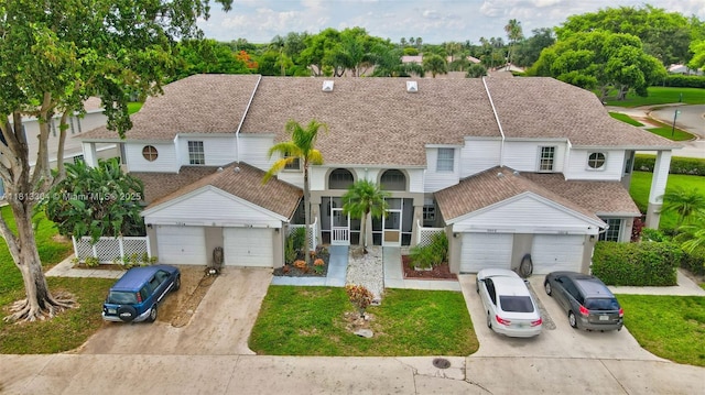 9280 Boca Gardens Pkwy Unit B, Boca Raton, FL 33496 - view of property with roof with shingles, concrete driveway, and a front lawn