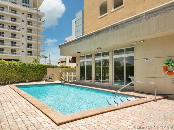 2425 SW 27th Ave Unit 705, Miami, FL 33145 - community pool featuring a patio