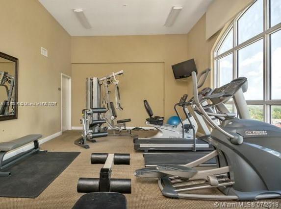 2425 SW 27th Ave Unit 705, Miami, FL 33145 - workout area featuring carpet