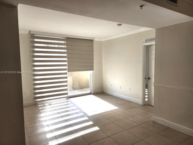 2425 SW 27th Ave Unit 705, Miami, FL 33145 - spare room with ornamental molding, tile patterned flooring, baseboards, fire sprinkler in ceiling, and a smoke detector
