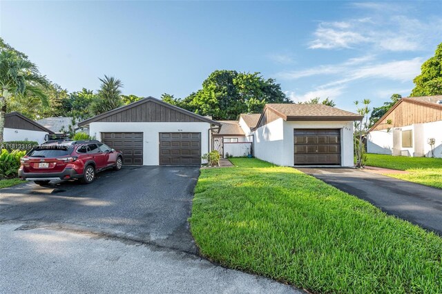 9234 Wedgewood Ln Unit D7, Tamarac, FL 33321 - ranch-style house featuring a detached garage, a front lawn, and stucco siding