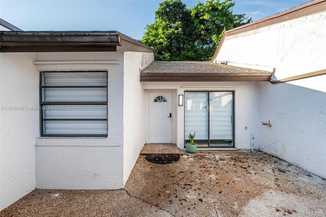 9234 Wedgewood Ln Unit D7, Tamarac, FL 33321 - doorway to property with stucco siding