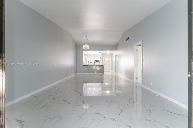 9234 Wedgewood Ln Unit D7, Tamarac, FL 33321 - spare room with marble tiled floors, baseboards, and a chandelier
