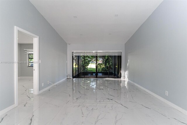 9234 Wedgewood Ln Unit D7, Tamarac, FL 33321 - spare room featuring marble tiled flooring, plenty of natural light, and baseboards