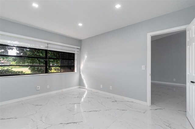 9234 Wedgewood Ln Unit D7, Tamarac, FL 33321 - unfurnished room with marble tiled floors, recessed lighting, and baseboards