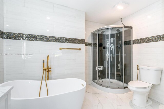 9234 Wedgewood Ln Unit D7, Tamarac, FL 33321 - full bath with tile walls, a freestanding tub, marble tiled flooring, a shower stall, and toilet