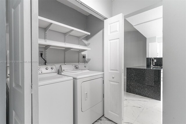9234 Wedgewood Ln Unit D7, Tamarac, FL 33321 - laundry area featuring light marble finish flooring and washing machine and dryer