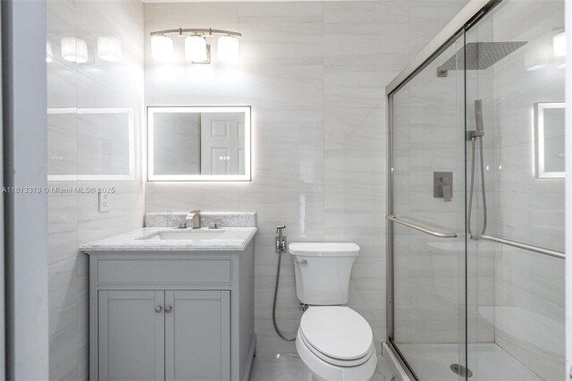 9234 Wedgewood Ln Unit D7, Tamarac, FL 33321 - full bath with a shower stall, vanity, toilet, and tile walls