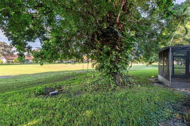 9234 Wedgewood Ln Unit D7, Tamarac, FL 33321 - view of grassy yard with a sunroom