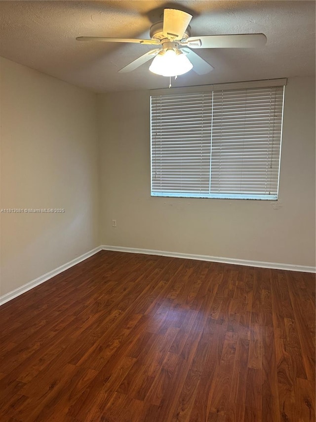 4828 N State Road 7 Unit 8107, Coconut Creek, FL 33073 - empty room with wood finished floors, a ceiling fan, baseboards, and a textured ceiling