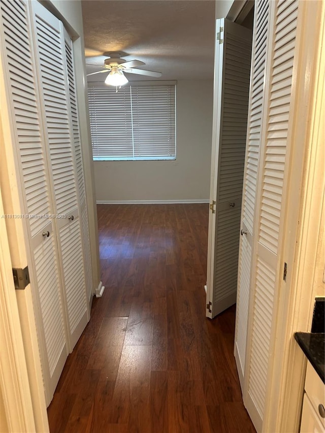 4828 N State Road 7 Unit 8107, Coconut Creek, FL 33073 - hall with dark wood-style floors and baseboards