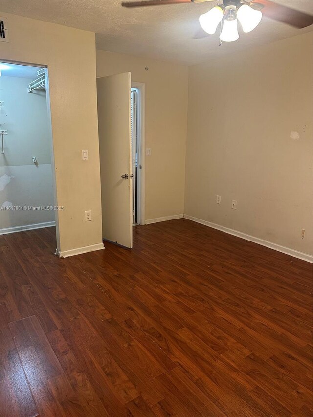 4828 N State Road 7 Unit 8107, Coconut Creek, FL 33073 - spare room with dark wood finished floors, a ceiling fan, and baseboards