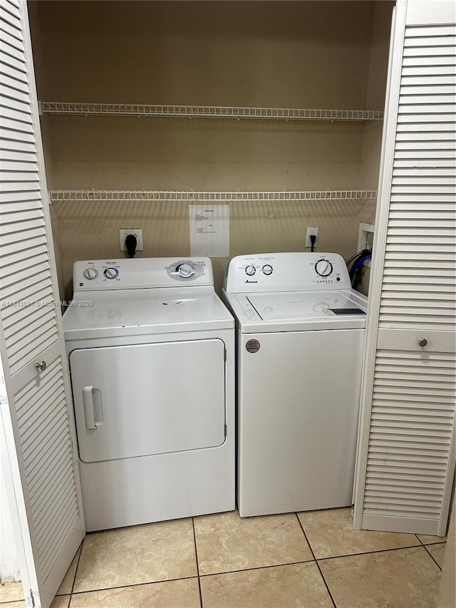 4828 N State Road 7 Unit 8107, Coconut Creek, FL 33073 - laundry area with independent washer and dryer and light tile patterned floors