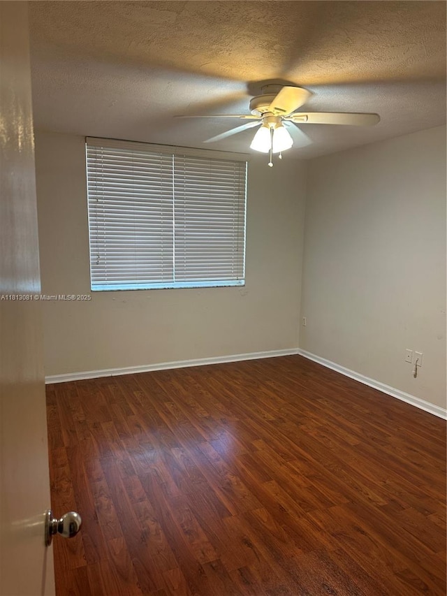 4828 N State Road 7 Unit 8107, Coconut Creek, FL 33073 - spare room featuring a ceiling fan, wood finished floors, baseboards, and a textured ceiling