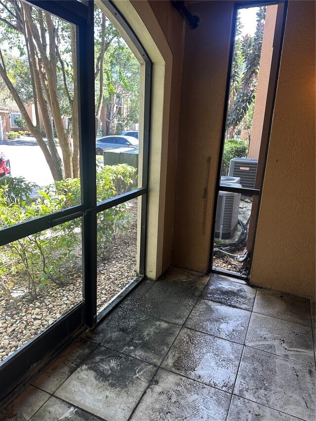4828 N State Road 7 Unit 8107, Coconut Creek, FL 33073 - doorway with stone tile floors