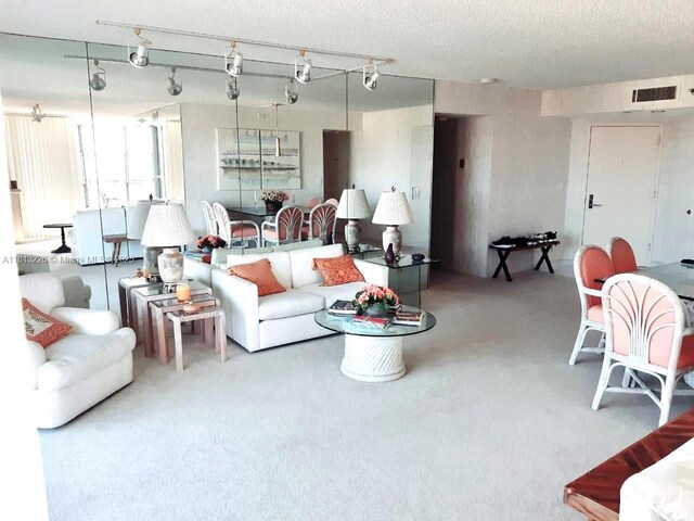 3530 Mystic Pointe Dr Unit 3001, Aventura, FL 33180 - living room with a textured ceiling and carpet