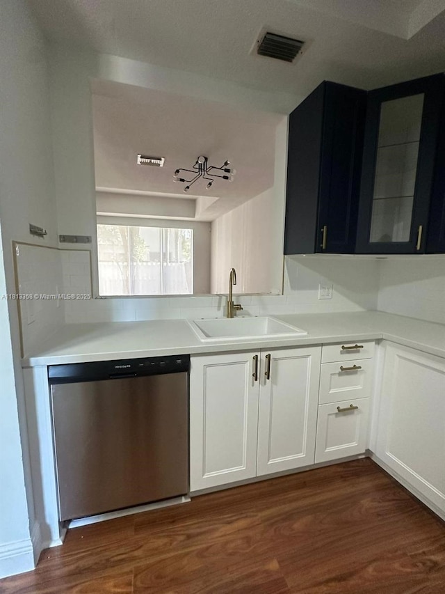 11281 NW 42nd Ter Unit 0, Doral, FL 33178 - kitchen featuring a sink, dishwasher, dark wood-style flooring, dark cabinetry, and light countertops