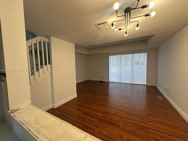 11281 NW 42nd Ter Unit 0, Doral, FL 33178 - spare room with wood finished floors, a textured ceiling, baseboards, and stairs
