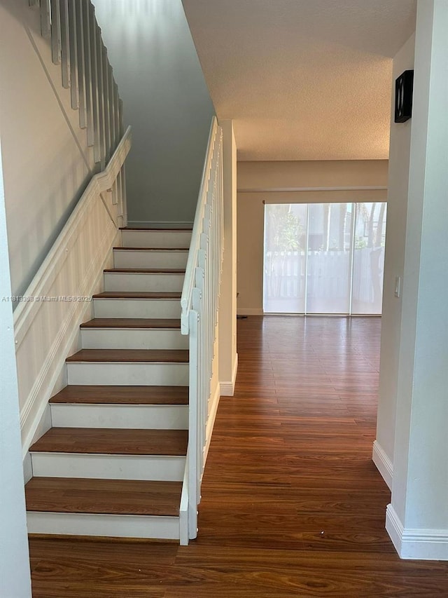 11281 NW 42nd Ter Unit 0, Doral, FL 33178 - stairs featuring wood finished floors and baseboards
