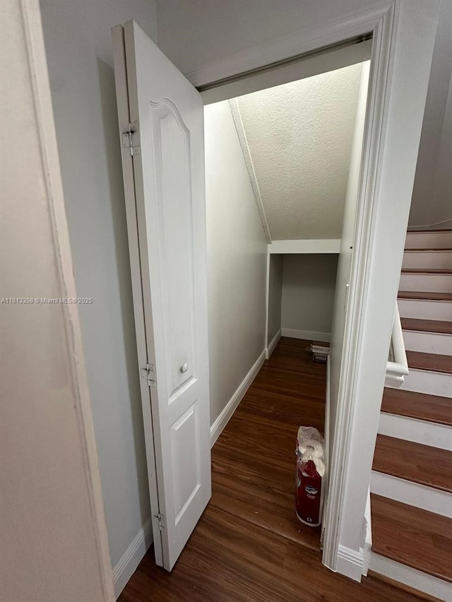11281 NW 42nd Ter Unit 0, Doral, FL 33178 - corridor with a textured ceiling, stairway, wood finished floors, and baseboards