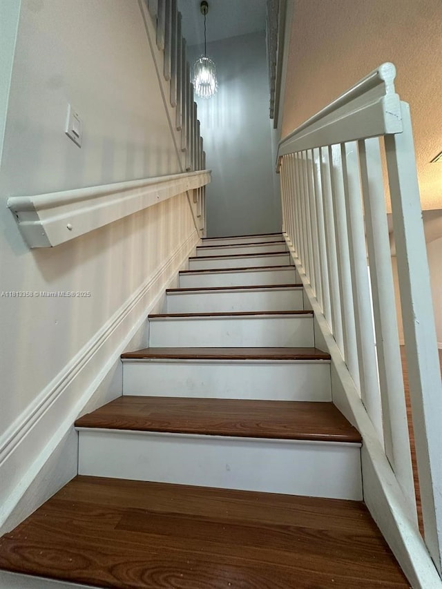11281 NW 42nd Ter Unit 0, Doral, FL 33178 - stairway featuring a chandelier