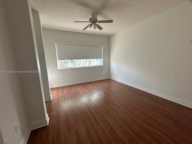 11281 NW 42nd Ter Unit 0, Doral, FL 33178 - spare room featuring ceiling fan, dark wood-type flooring, baseboards, and a textured ceiling