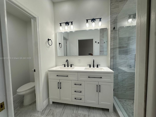 11281 NW 42nd Ter Unit 0, Doral, FL 33178 - bathroom with a shower stall, double vanity, toilet, and baseboards