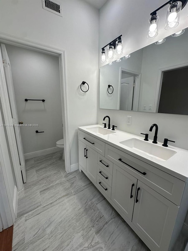 11281 NW 42nd Ter Unit 0, Doral, FL 33178 - full bath featuring double vanity, baseboards, and toilet