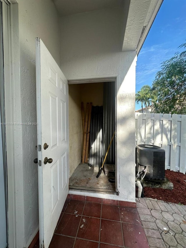 11281 NW 42nd Ter Unit 0, Doral, FL 33178 - property entrance with central AC unit and stucco siding