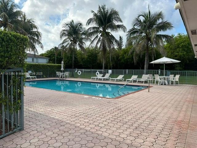 11281 NW 42nd Ter Unit 0, Doral, FL 33178 - community pool featuring a patio