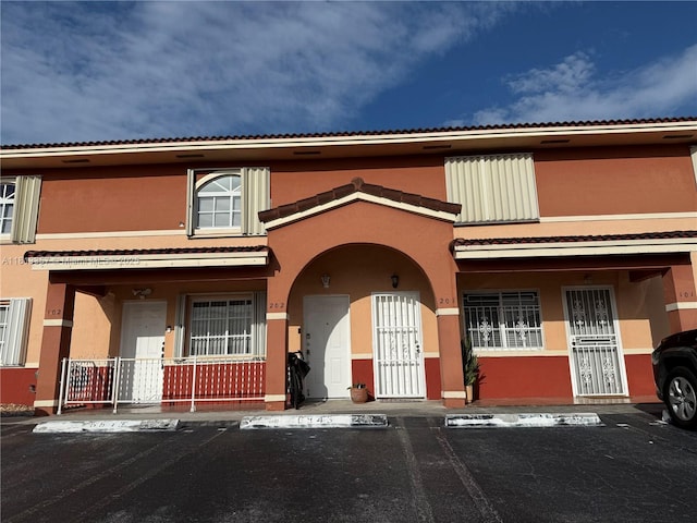 6823 W 36th Ave Unit 201, Hialeah, FL 33018 - view of building exterior with uncovered parking