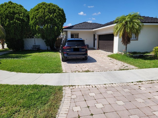 14730 SW 142nd St, Miami, FL 33196 - single story home featuring decorative driveway, an attached garage, and stucco siding