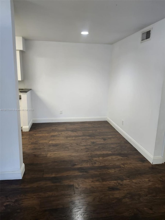 833 Riverside Dr Unit 834, Coral Springs, FL 33071 - unfurnished room featuring baseboards, dark wood finished floors, and recessed lighting