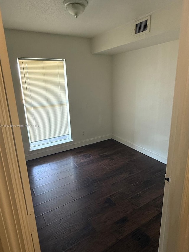 833 Riverside Dr Unit 834, Coral Springs, FL 33071 - empty room with dark wood finished floors and baseboards
