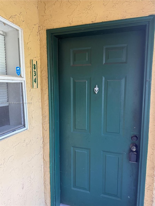 833 Riverside Dr Unit 834, Coral Springs, FL 33071 - view of exterior entry with stucco siding