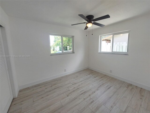 4579 NW 16th Way, Tamarac, FL 33309 - unfurnished room featuring light wood finished floors, ceiling fan, and baseboards