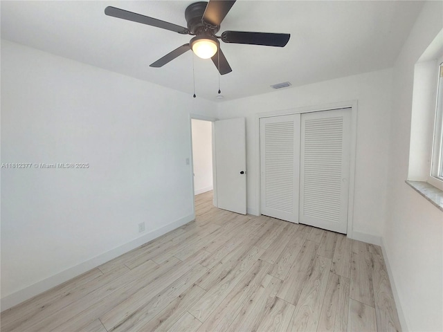 4579 NW 16th Way, Tamarac, FL 33309 - unfurnished bedroom with wood finished floors, baseboards, a closet, and a ceiling fan