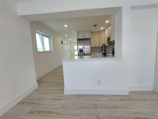 4579 NW 16th Way, Tamarac, FL 33309 - kitchen featuring stainless steel appliances, recessed lighting, light countertops, a sink, and decorative backsplash