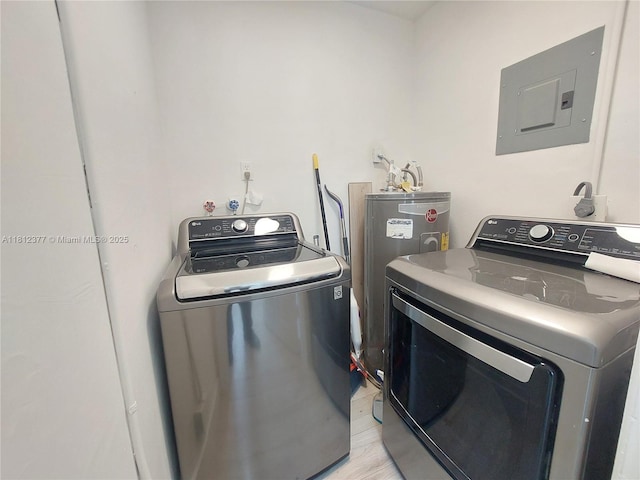 4579 NW 16th Way, Tamarac, FL 33309 - laundry area featuring electric panel, washer and clothes dryer, and water heater