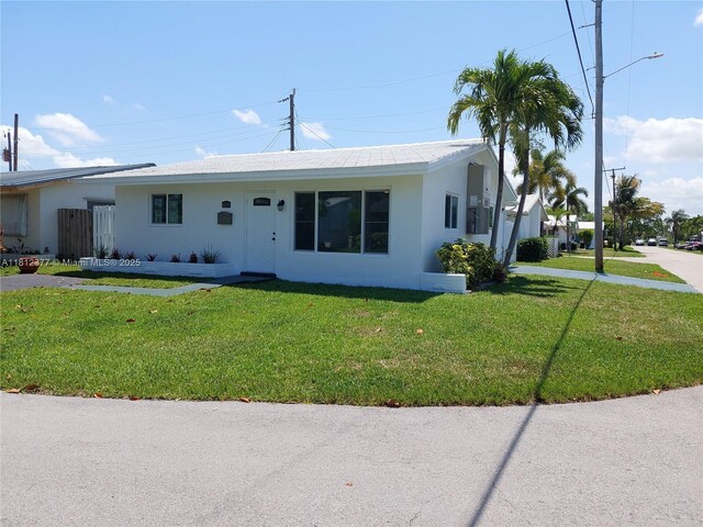 4579 NW 16th Way, Tamarac, FL 33309 - ranch-style house with a front yard and stucco siding