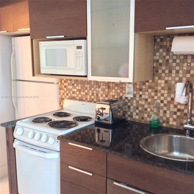 100 Lincoln Rd Unit 1214, Miami Beach, FL 33139 - kitchen featuring white appliances, a sink, decorative backsplash, and modern cabinets