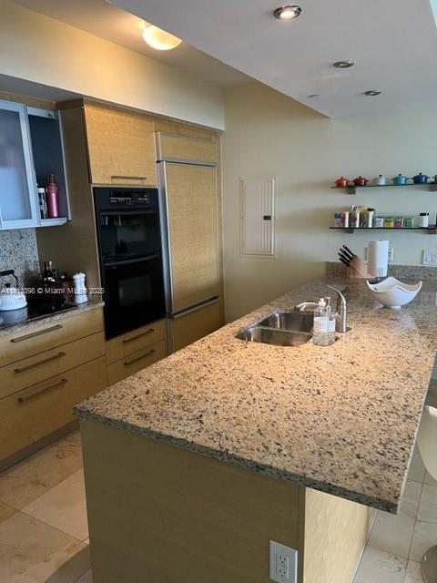 1830 S Ocean Dr Unit 2103, Hallandale Beach, FL 33009 - kitchen featuring a sink, black appliances, light tile patterned floors, and light stone counters